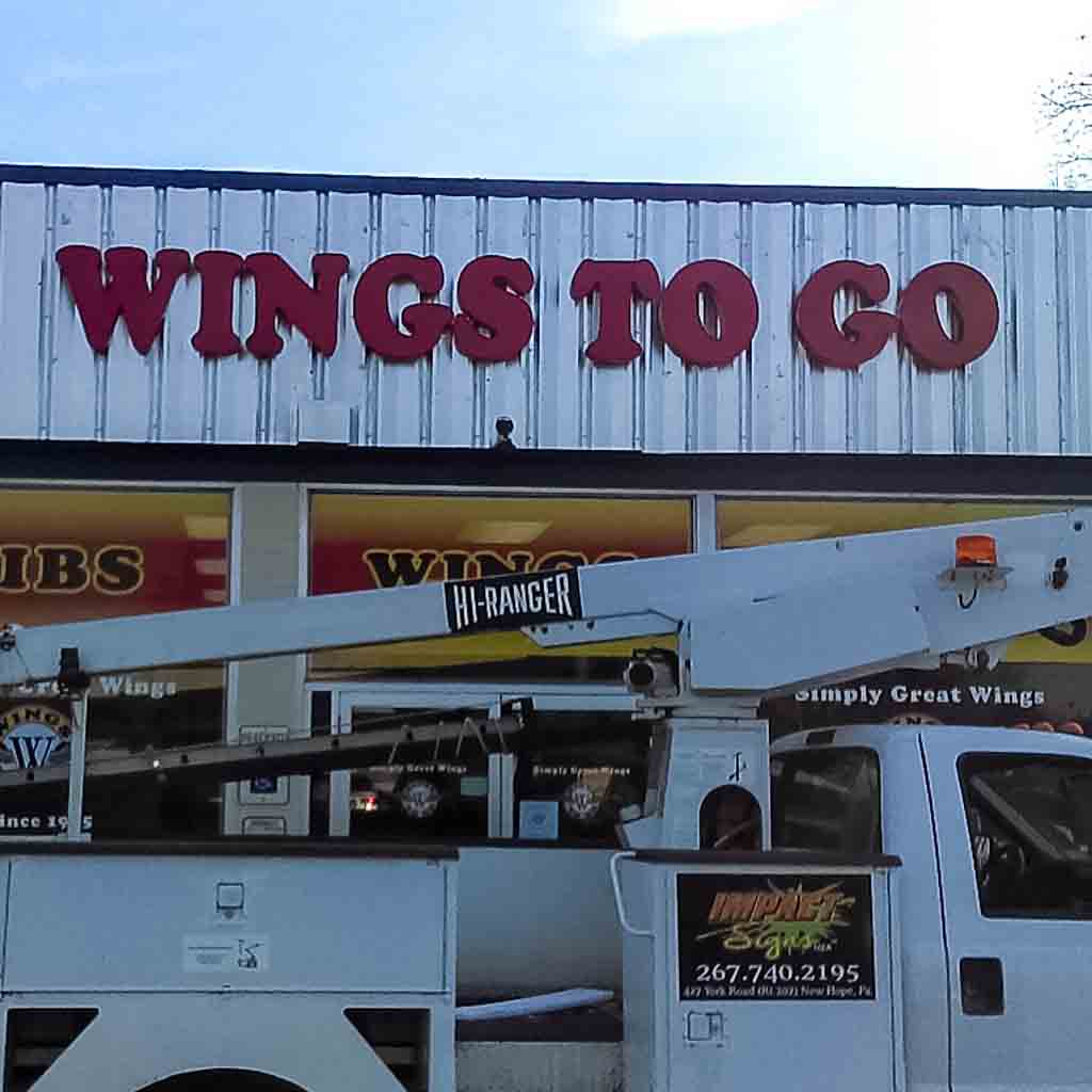 Wings to go sign